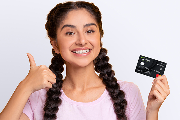 Teen with credit card giving thumbs up